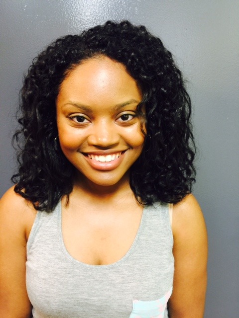 Client 3 after her Olaplex Stand Alone Treatment: defined curls, front view