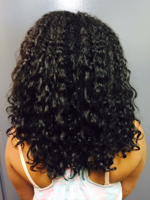 Client 3 after her Olaplex Stand Alone Treatment: defined curls, back view